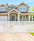 Heavy Duty Retractable Baby Gate And Dog Barrier With Slick Glide Action Covers Hella Wide Openings For Garages Driveways Living Rooms Provides No Fuss Everyday Safety In White with children and dog running.