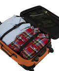 Expandable Spinner Carry On Luggage 19 Inch Orange That Rolls Easy With Four Directional Wheels open showing packed clothes