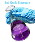 Gloved hand holding 300 mL Go To Lab Erlenmeyer Flask Set With Borosilicate Glass, filled with purple liquid, for chemistry use.