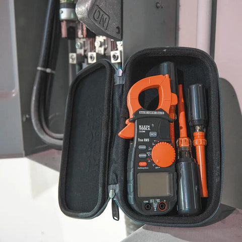 Tradesman Pro Large Hard Case For Meters Tools And Tech Gear With Rugged Hard Shell Soft Lined Interior Durable Zipper And Handy Pocket Space Compact 10.25 By 2.25 By 5.5 Inch Case For Easy Transport holding orange meter with accessories