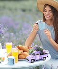 Mini Lavender Metal Truck With Lavender Bouquet Farmhouse Decor on table beside smiling woman with coffee