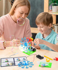 Parent and child building a bubble machine from 6 In 1 STEM Robotics Kit For Kids 8 To 13 With Reptile Robot Balance Car Bubble Machine.