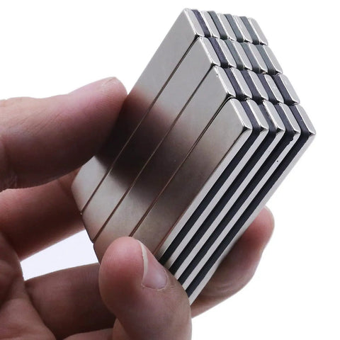Heavy Duty Badass Neodymium Bar Magnets, 24 Pack Rare Earth Kickass Adhesive Backing held in hand, showing size and shape.