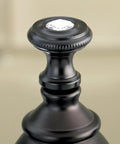 Close-up of crystal lever handle on Oil Rubbed Bronze Centerset Bathroom Faucet With Crystal Lever Handle Drip Free Ceramic Cartridge
