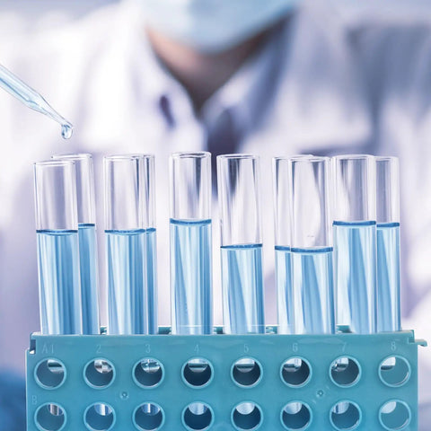 Lab setting with blue test tubes in Must-Have Four Way Plastic Test Tube Rack Kit For Lab Experiments Interlocking Tube Holder Stand
