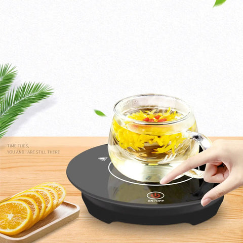 Kickass Smart Touch Cup Warmer Plate 15W Constant Temperature Heating Coaster with tea in glass mug and hand pressing control