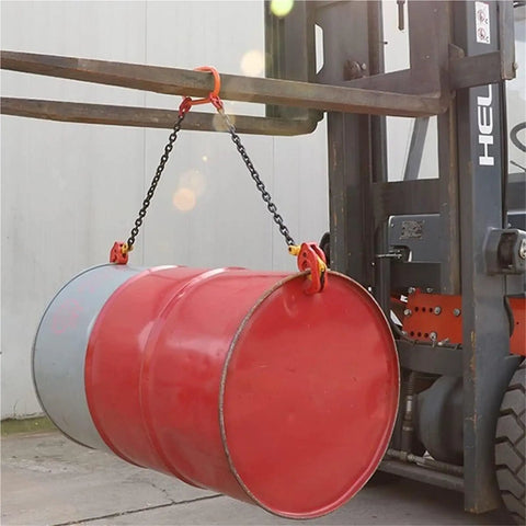 Heavy Duty 2200 Lbs Vertical Drum Lifter With Double Chains For Metal Barrels lifting red and gray steel barrels with a forklift.