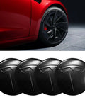 Set Of Four Aluminum Waterproof Wheel Cover Center Emblem Sticker For Tesla Model 3 And Model Y 56mm Hubcaps Rim Cover Matte Black Finish For A Sleek Oem Look And Rugged Daily Driver Upgrade shown on a red car.