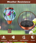 Solar Hot Air Balloon Lantern With Flamingo Pattern Waterproof Outdoor Hanging Lights in garden during rain