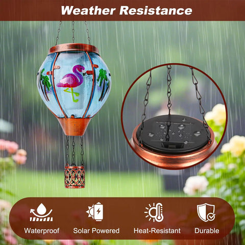 Solar Hot Air Balloon Lantern With Flamingo Pattern Waterproof Outdoor Hanging Lights in garden during rain