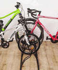 Heavy Duty Bicycle Floor Parking Rack Stand For Mountain And Road Bikes Indoor Home Garage Storage Stable Vertical 3 Bike Holder With Tire Grooves Easy Load Space Saver Durable shown with three bikes