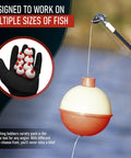 Ultimate Fishing Bobber Assortment Pack With Snap On Style Red And White Bobbers in various sizes next to fishing rod