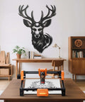 ACMER S2 12W laser engraver on wooden table; orange and black, front view