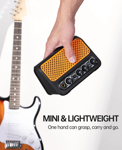Hand holding 10W Mini Electric Guitar Amplifier With Clean And Overdrive Channels, Reverb, Bluetooth Streaming, black and orange.