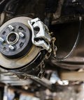 Installed Universal 18-Inch Rubber Brake Hose, 3/8-24 External To 3/8-24 Internal Threads, durable black hydraulic brake line.