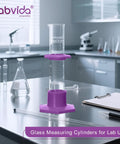Durable Pro Grade Borosilicate Glass Measuring Cylinder Set With Hex Base And Brush Includes 10 ML 25 ML 50 ML And 100 ML Cylinders Class B Lab Glassware For Chemistry Experiments And Education in a lab.