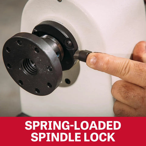 Close-up of 12 By 21 Inch Variable Speed Woodworking Lathe With 1 HP showing spring-loaded spindle lock mechanism in use by hand.