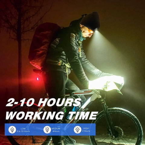 Person biking at night using LED USB Rechargeable Beanie Light Kit 4 Pack With Rubber Pieces For Hat Illumination Easy Install.