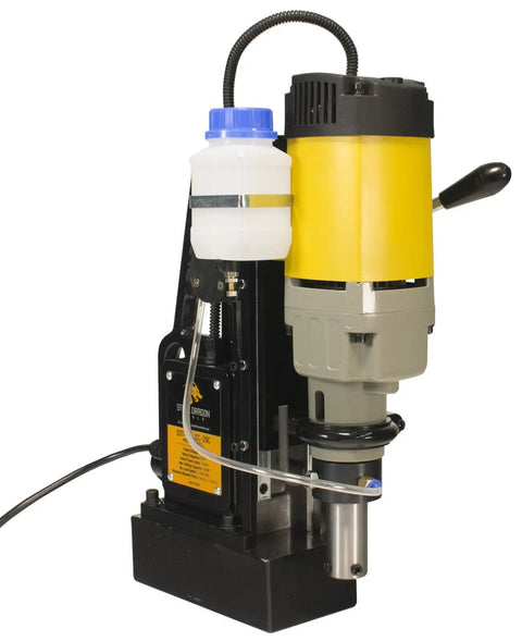 Heavy Duty Magnetic Drill Paired With Seven Piece 2 Inch HSS Annular Cutter Kit For Grit And Grind Metal Fabrication And Tough Job Site Demands Featuring Smooth Rack And Pinion Depth Control Rig with yellow and gray motor.
