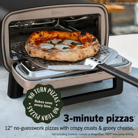 Backyard Pizza Oven With Stone 12 Inch Ready In Just 3 Minutes For Artisan Crusts With 700F Max Temperature Five In One Functionality Bake Broil Proof And Warm Makes Full Family Meals Outdoors For Your Cookout Gray MO201 displaying a baked pizza with crispy crust on a spatula.