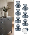 Hella Sleek Grey Aluminum Self Adhesive Drawer Pulls Stick On Cabinet Knobs For Kitchen Bathroom Vanity 8 Piece Set displayed on furniture.