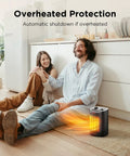 Couple sitting near 1500W Ceramic Space Heater For Desk And Office with overheating protection indication.