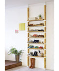 Floor To Ceiling 2 X 4 Mounting Brackets For Heavy Duty Vertical Storage And Diy Wall Shelves Featuring Smooth Sailing Setup And Renter Friendly Design That Shields Drywall While Delivering Knockout Support, showcasing a shoe storage unit.