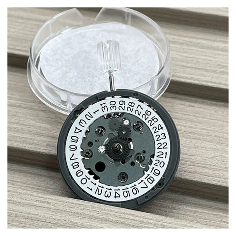 NH34 Compatible Automatic Mechanical Movement Kit With 24 Hour Hands And 3.0 Date displayed on wooden surface