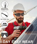 Worker wearing sunglasses from Bulk Safety Glasses Pack 80 Count with drill at construction site, highlighting design features.
