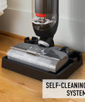 Corded Hard Floor Cleaner Machine Delivering No Sweat Washing And Vacuum In One Move With Smart Edge Reach on a wooden floor.