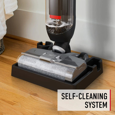 Corded Hard Floor Cleaner Machine Delivering No Sweat Washing And Vacuum In One Move With Smart Edge Reach on a wooden floor.