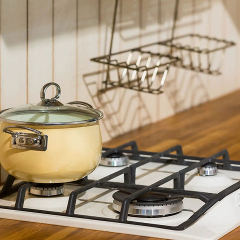 4 Cooker Hat Set For Oven And Gas Hob Burner Caps Crown Flame Covers on modern stove with yellow pot