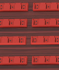 Eight red Three Slot 18V Battery Holder Mounts for workshop garage van shelf and toolbox organization on a wooden surface.