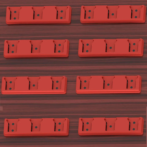 Eight red Three Slot 18V Battery Holder Mounts for workshop garage van shelf and toolbox organization on a wooden surface.