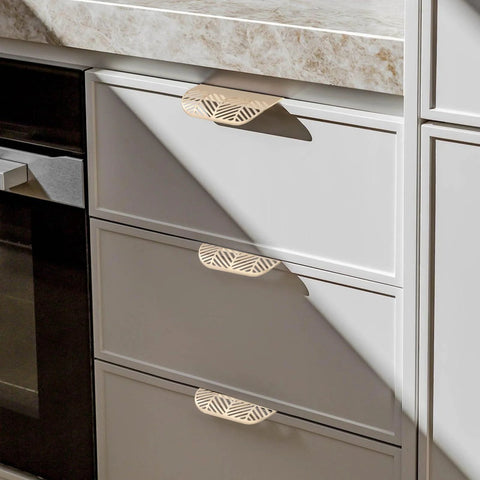 Leaf Shaped Cabinet Pulls 2 Pack Curved Hollow Gold Leaf Drawer Handles In Zinc Alloy with 96mm Hole Spacing on white drawers