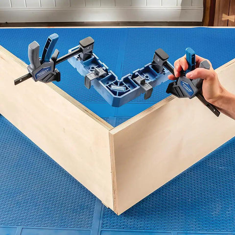 90 Degree Clamp It Assembly Square for Woodworking and Cabinet Installations showing precise right angle alignment on wood piece.
