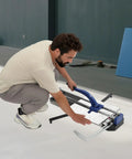 Man using a Heavy Duty 24 Inch Manual Tile Cutter For Ceramic And Porcelain Floors on a tile surface.