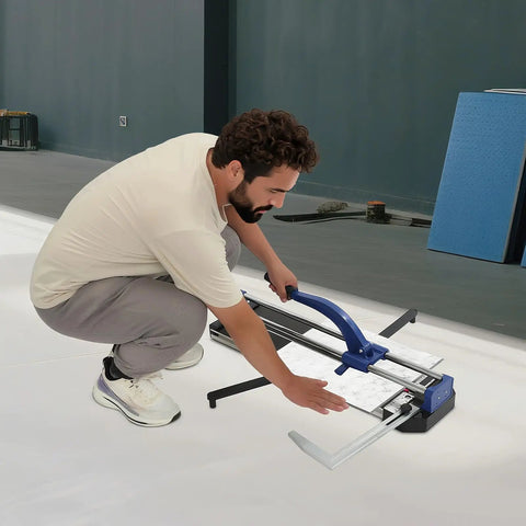 Man using a Heavy Duty 24 Inch Manual Tile Cutter For Ceramic And Porcelain Floors on a tile surface.