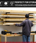 Heavy Duty Wall Mounted Lumber Rack With Rock Solid Four Level Metal Shelf For Garage And Workshop Mega 800 Pound Capacity Black Steel Tool Storage Organizer System, showing wood being stored on a wall-mounted rack.