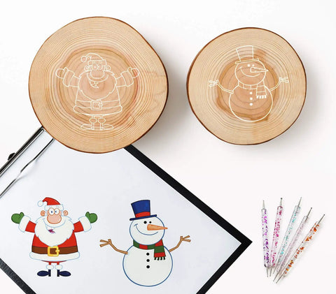 100 Sheets White Carbon Transfer Paper 11.7 By 8.3 Inches With Pattern Tracing Stylus For Wood Burning And Wood Carving Easy Pattern Transfer And Trace For DIY Craft Projects showing wood slices with traced Santa and snowman designs and colorful styluses.