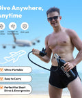 Man holding S400 Mini Scuba Tank 1.0L Portable Diving Tank with On/Off Valve on beach, showcasing lightweight and portable size.