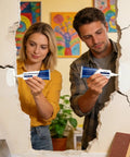 Two people using Drywall Repair Paste Wall Mending Putty With Scraper And Crack Filler Kit for home wall repair in an apartment.