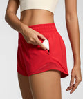 Womens Quick Dry Running Shorts 2.5 Inch Inseam With High Waisted Zip Pockets Lightweight Gym Shorts Built In Liner And Mesh Panels For Breathable Comfort And Free Range Of Motion Red XS showing zip pocket detail