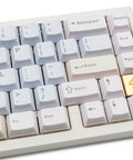 Close-up of 65 Percent Wireless Mechanical Keyboard Features Hotswap Switches, showing CNC aluminum keys and gold accent.