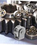 Heavy Duty Stainless Steel Pulley Wheel Set For Sliding Door Tracks on industrial gear surface, emphasizing high load capacity.