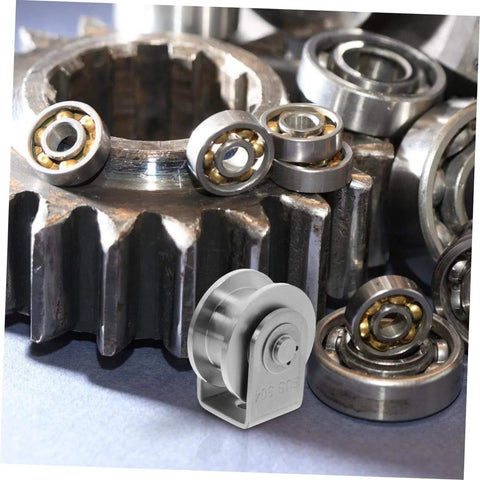 Heavy Duty Stainless Steel Pulley Wheel Set For Sliding Door Tracks on industrial gear surface, emphasizing high load capacity.