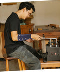 Cut Resistant Wrist Sleeves With Breathable Forearm Guards offering protection during auto repair in a workshop setting.