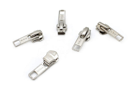 Zip Repair Kit With Metal Aluminum Sliders And Top And Bottom Stops, Assorted Sizes 3, 4.5, 5, And 10, Easy Storage Container, Fix Broken Zippers Fast - image showing five metal zipper sliders on white background