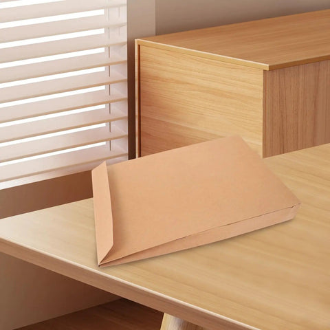 Kraft Mailing Envelopes 10 Pack With Double Sided Adhesive Seal Self Sealing Shipping Bags on wooden desk