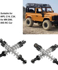 Adjustable Oil Shock Absorbers For 1/18 1/16 RC Crawlers, 4 Piece Metal Black Shocks Upgrade Kit next to orange RC vehicle